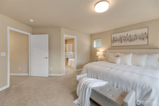 carpeted bedroom featuring ensuite bathroom