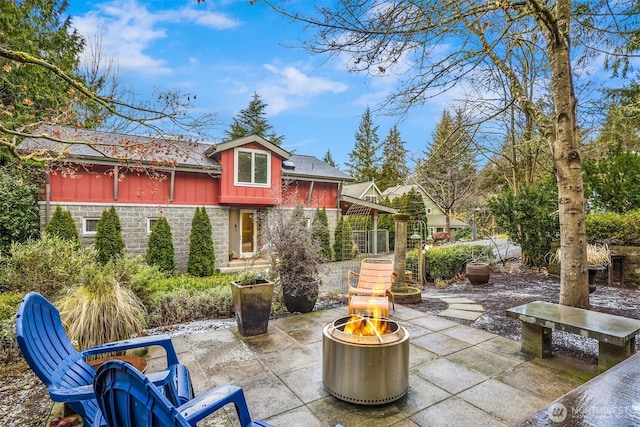 view of patio / terrace featuring a fire pit