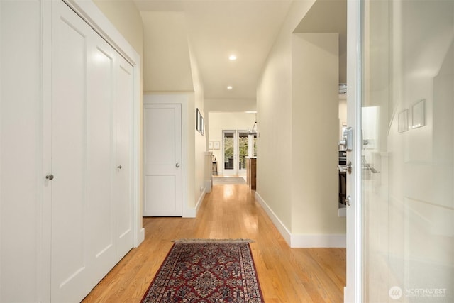 hall with light hardwood / wood-style floors