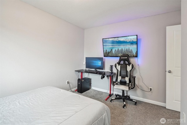 bedroom featuring carpet floors and baseboards