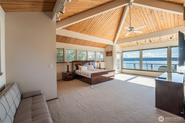 carpeted bedroom with track lighting, baseboards, wood ceiling, access to exterior, and vaulted ceiling with beams