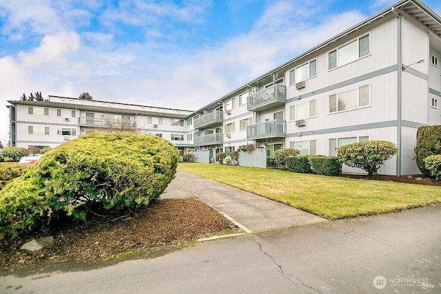 view of property's community with a lawn