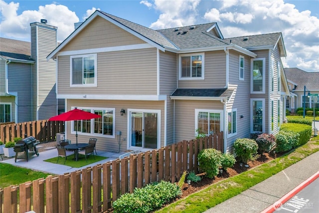 back of property featuring a patio