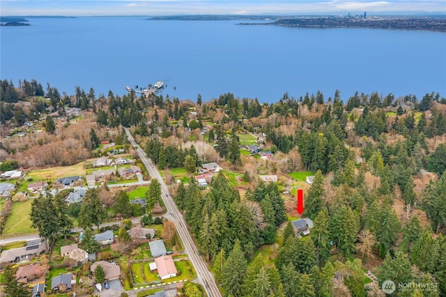 birds eye view of property with a water view