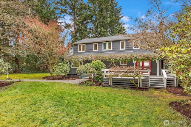 colonial home featuring a front yard and a chimney