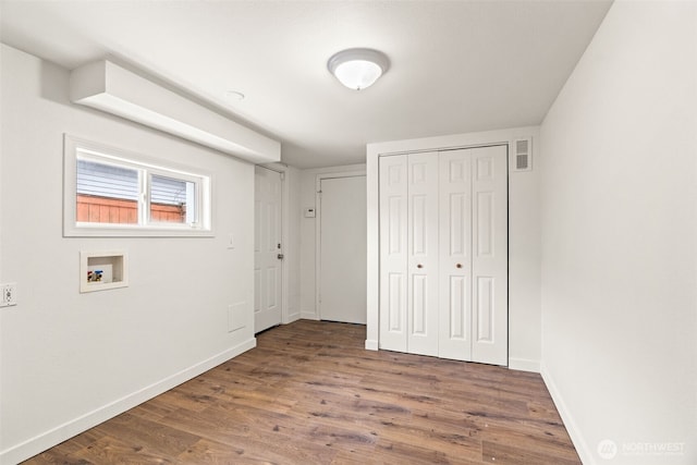 clothes washing area with washer hookup and dark hardwood / wood-style floors