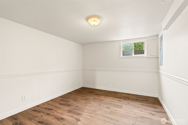 unfurnished room with wood-type flooring