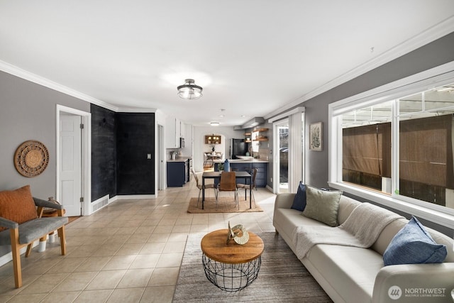 living room with ornamental molding, light tile patterned flooring, visible vents, and baseboards