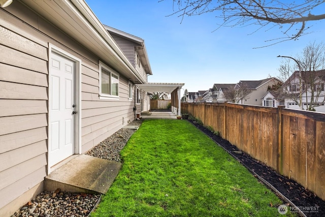 view of yard with fence and a residential view