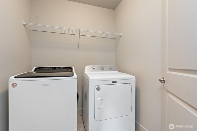 laundry area with laundry area and separate washer and dryer