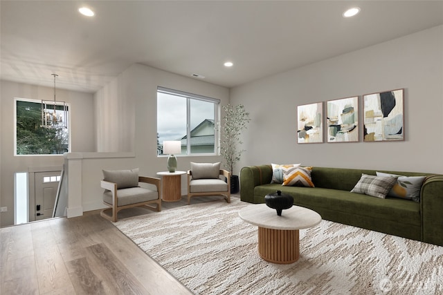 living room featuring a healthy amount of sunlight, wood finished floors, and recessed lighting