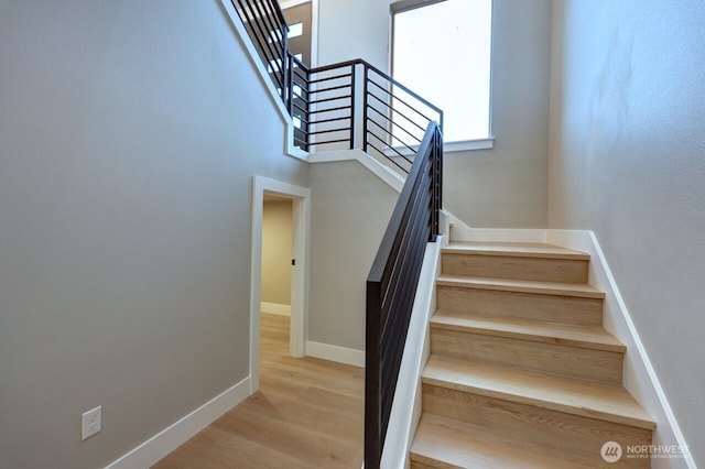 stairway featuring hardwood / wood-style floors