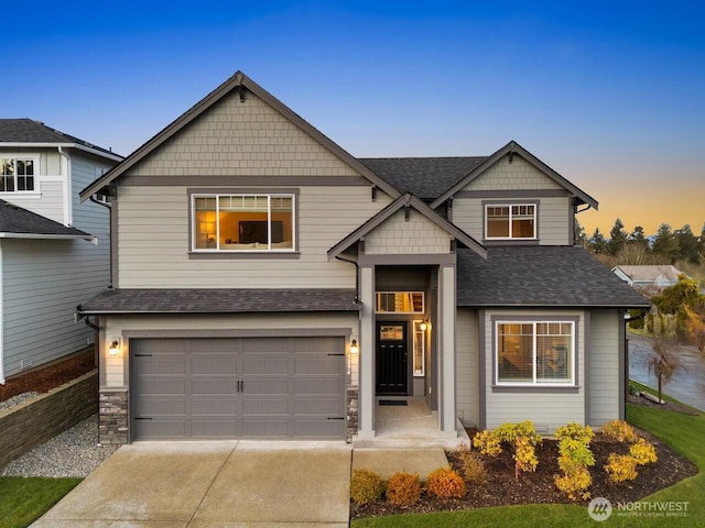 craftsman inspired home featuring a garage