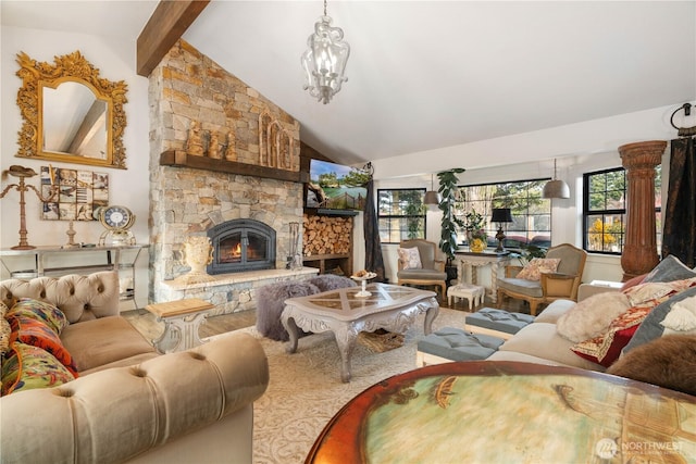 living room featuring high vaulted ceiling, beam ceiling, a stone fireplace, and an inviting chandelier