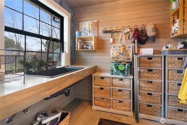 office area featuring wood walls