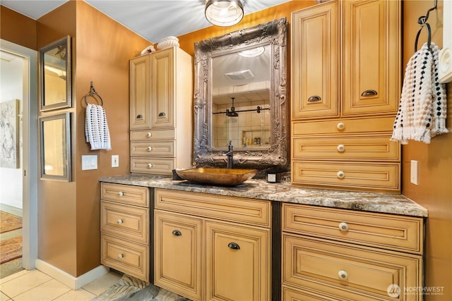 full bathroom with vanity, baseboards, and tile patterned floors