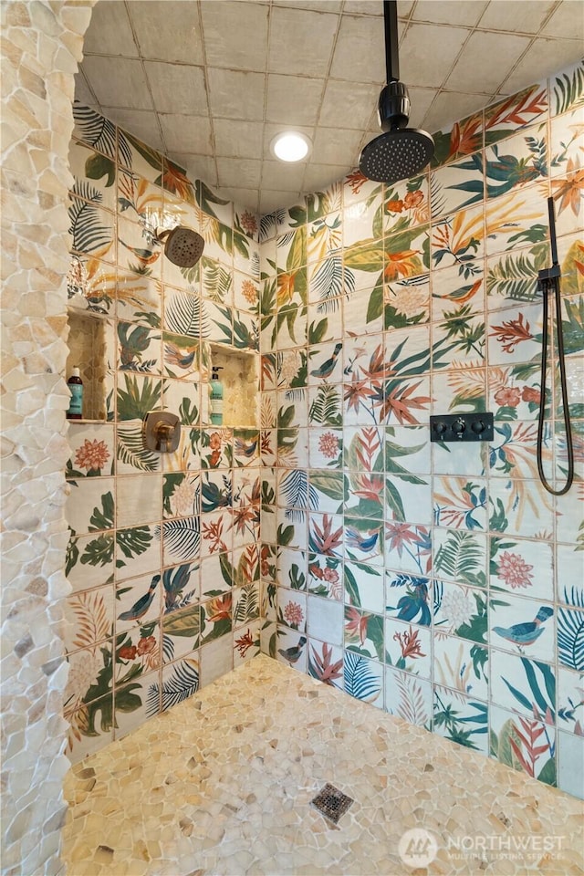 full bath featuring a tile shower and a paneled ceiling