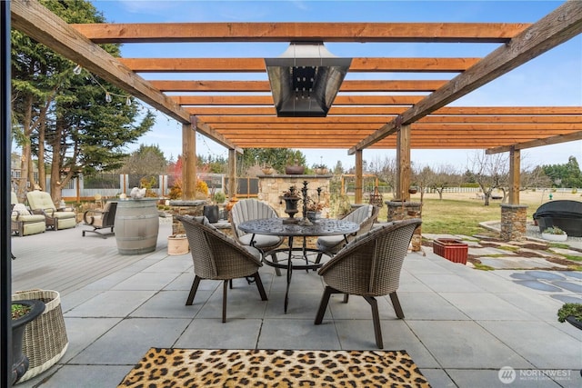 view of patio / terrace featuring fence, outdoor dining area, and a pergola