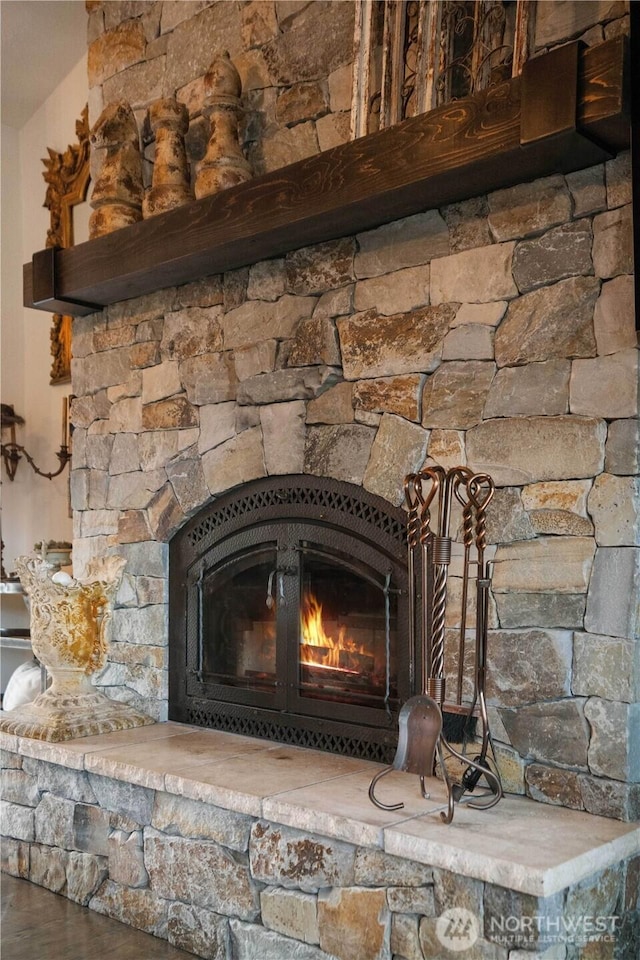 interior details with a fireplace and wood finished floors