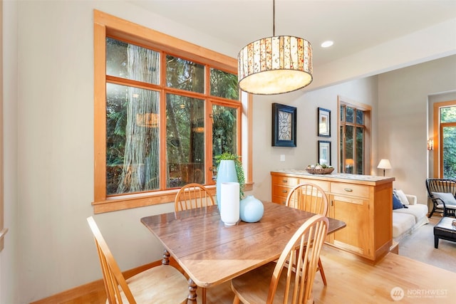 dining area with light wood-type flooring