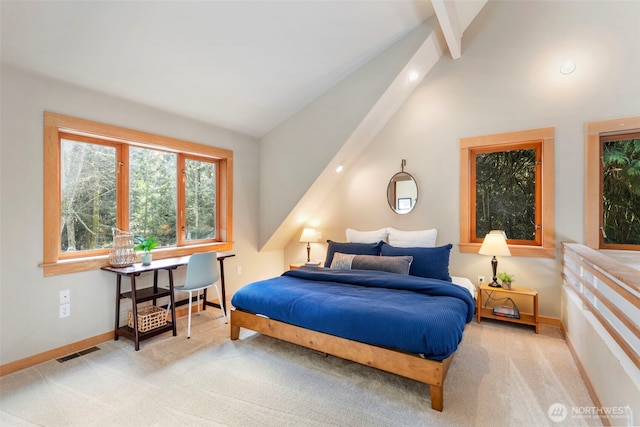 carpeted bedroom featuring lofted ceiling with beams