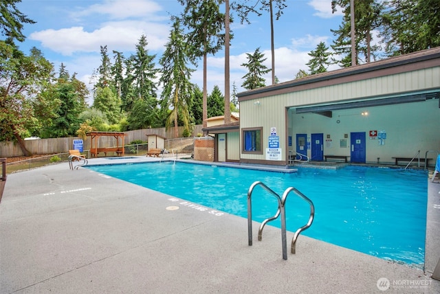 view of swimming pool with a patio area