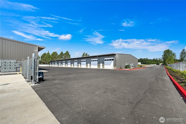 view of road featuring community garages