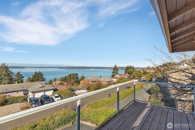 wooden deck featuring a water view