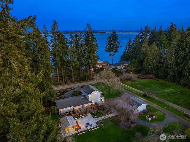 birds eye view of property with a water view