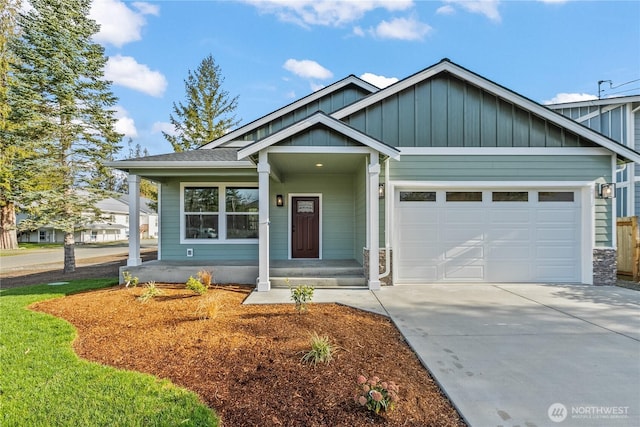 view of front of house with an attached garage, board and batten siding, and driveway