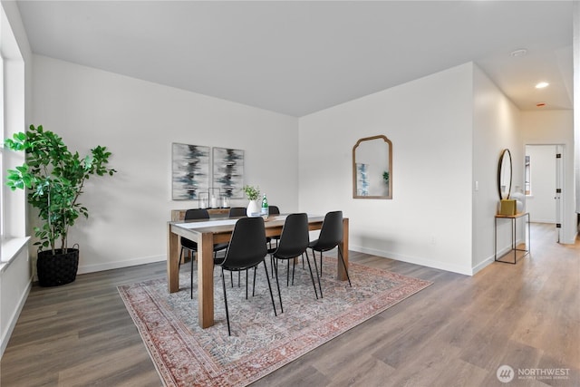 dining area with recessed lighting, baseboards, and wood finished floors