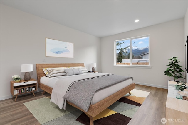 bedroom featuring recessed lighting, baseboards, and light wood-style flooring