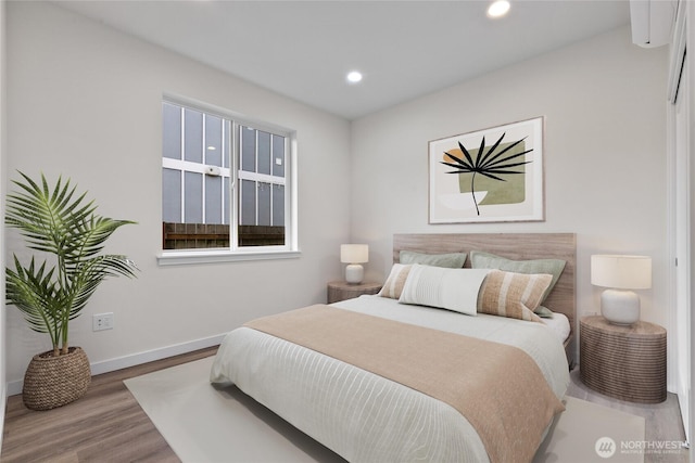 bedroom featuring recessed lighting, baseboards, and wood finished floors