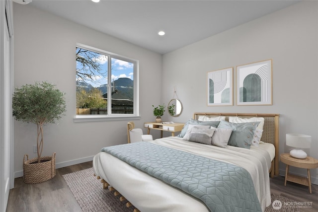 bedroom featuring recessed lighting, baseboards, and wood finished floors