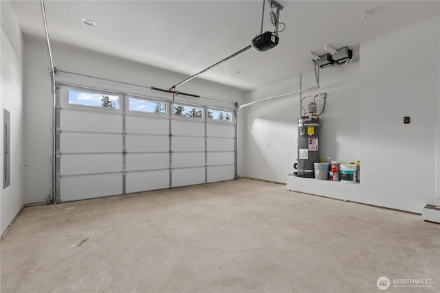 garage with a garage door opener and electric water heater