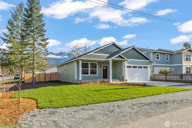 view of front of property with fence, board and batten siding, concrete driveway, a front yard, and a garage