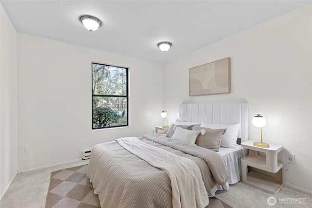 carpeted bedroom with baseboard heating