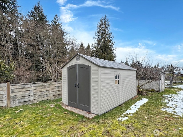 view of outdoor structure with a lawn