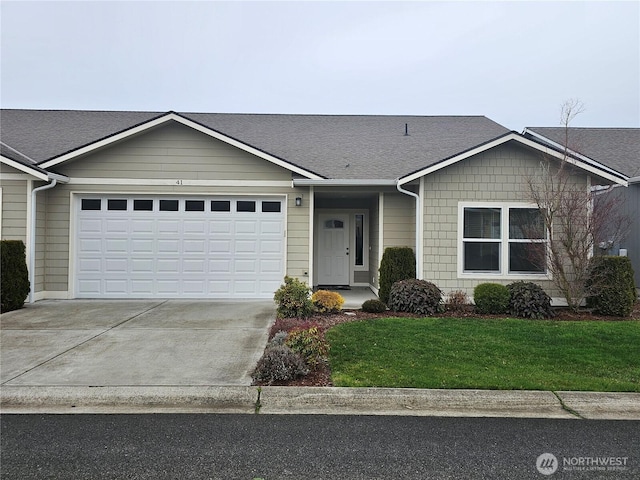 single story home with a garage and a front yard