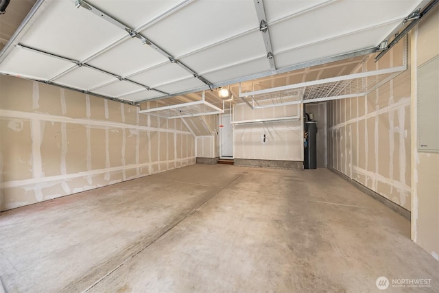 garage with water heater and a garage door opener