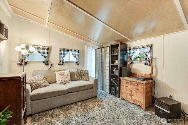 living area featuring lofted ceiling