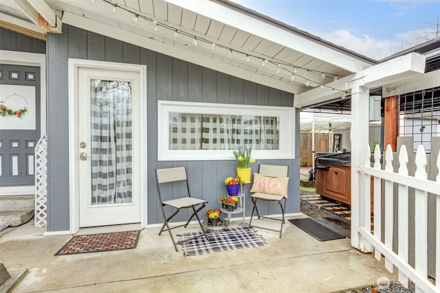 entrance to property featuring fence