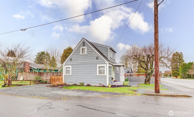 view of home's exterior featuring fence