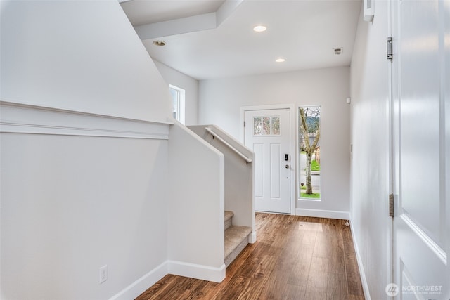 entrance foyer with recessed lighting, baseboards, wood finished floors, and stairs