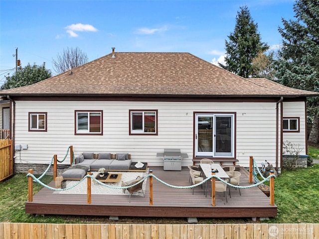 rear view of property featuring an outdoor living space and a wooden deck