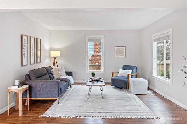 living room featuring a textured ceiling and dark hardwood / wood-style floors