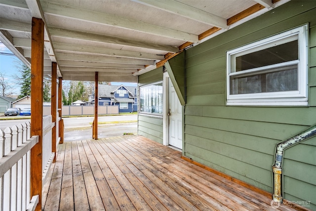 wooden terrace with a carport