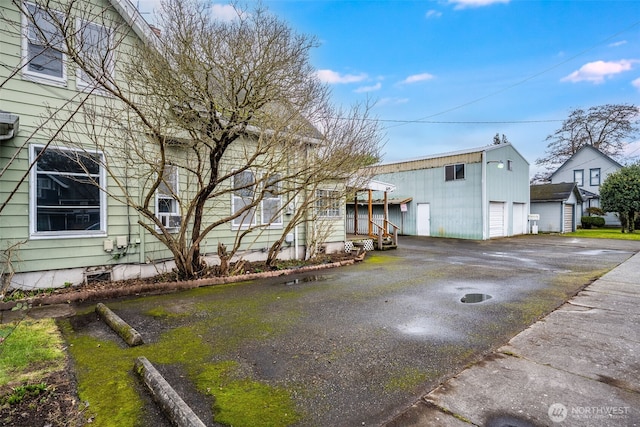 view of side of property with an outbuilding