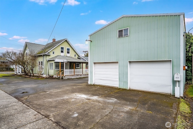 view of front of house featuring a garage and a porch