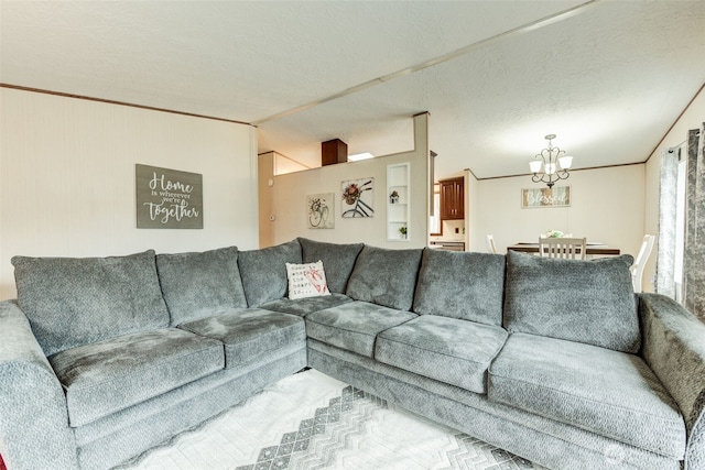 living area featuring lofted ceiling, crown molding, a chandelier, and a textured ceiling